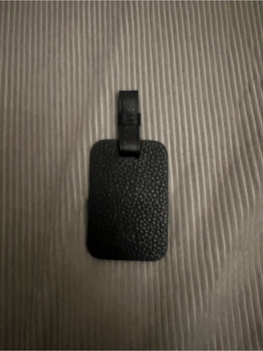Rimowa black bookbag tag